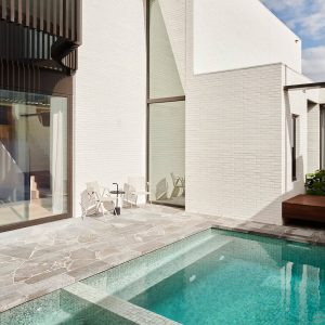 London Grey Crazy Pavers installed around pool coping